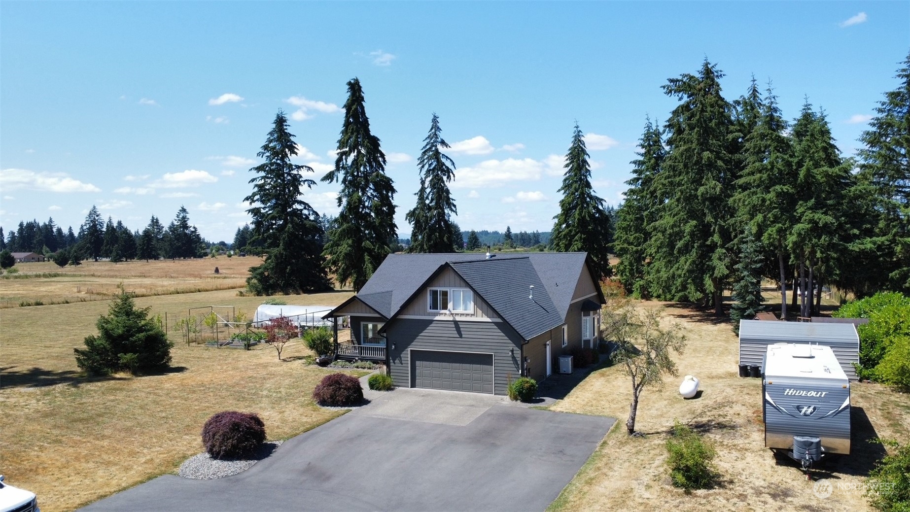 16637 Sheldon Lane Southwest Rochester, WA 98579 - Photo 35 of 40 a view of a house with outdoor space and lake view