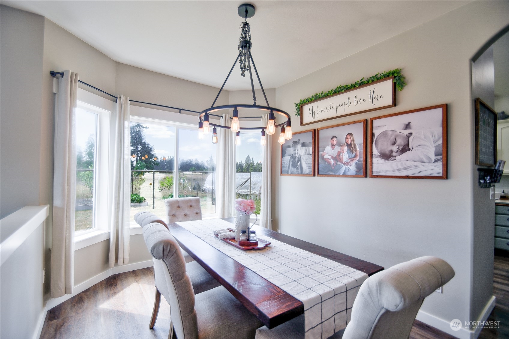 16637 Sheldon Lane Southwest Rochester, WA 98579 - Photo 8 of 40 a view of a dining room with furniture window and wooden floor