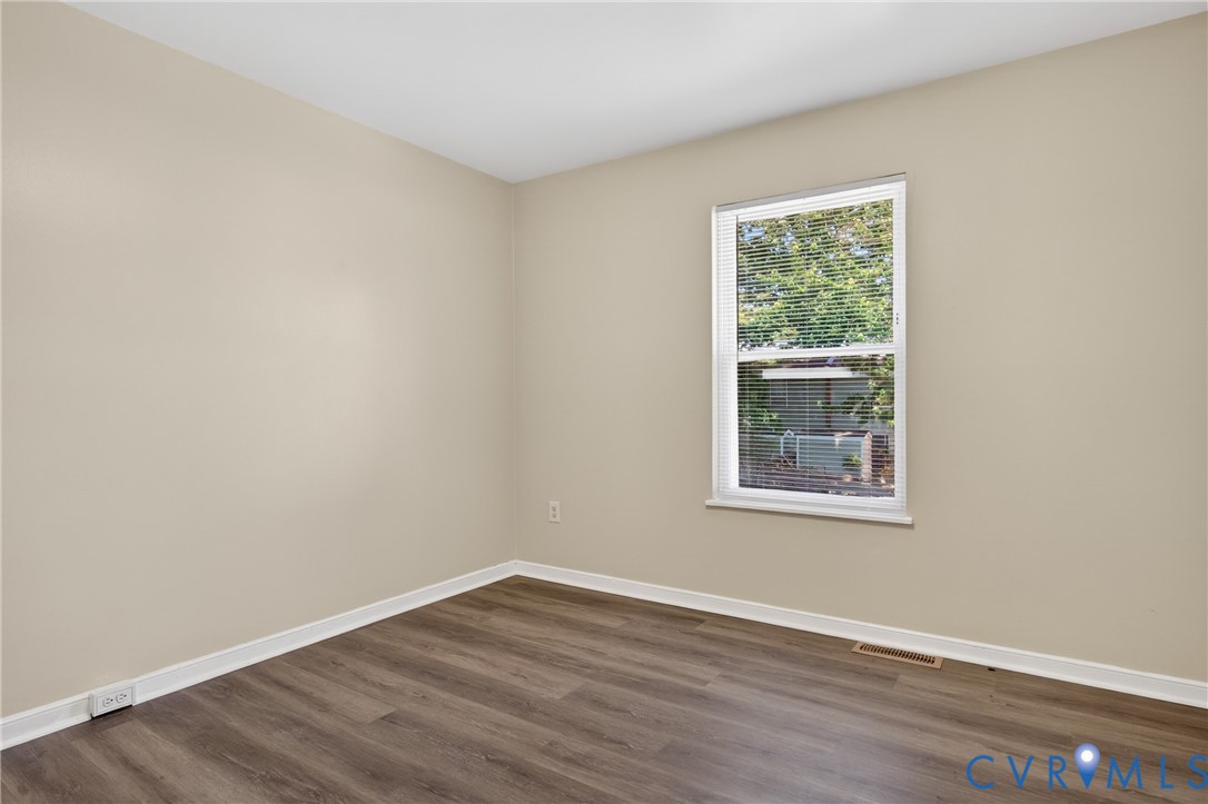 10050 Purcell Road Richmond, VA 23228 - Photo 20 of 26 an empty room with wooden floor and windows