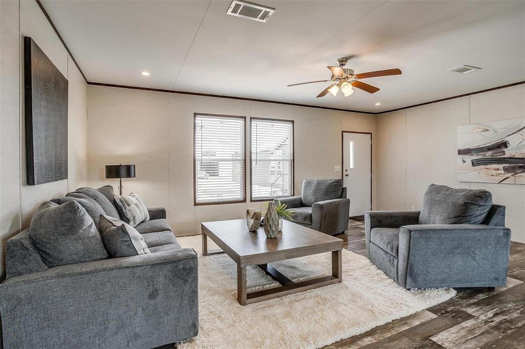 242 Huddleston Road Sunset, TX 76270 - Photo 3 of 18 a living room with furniture and a large window