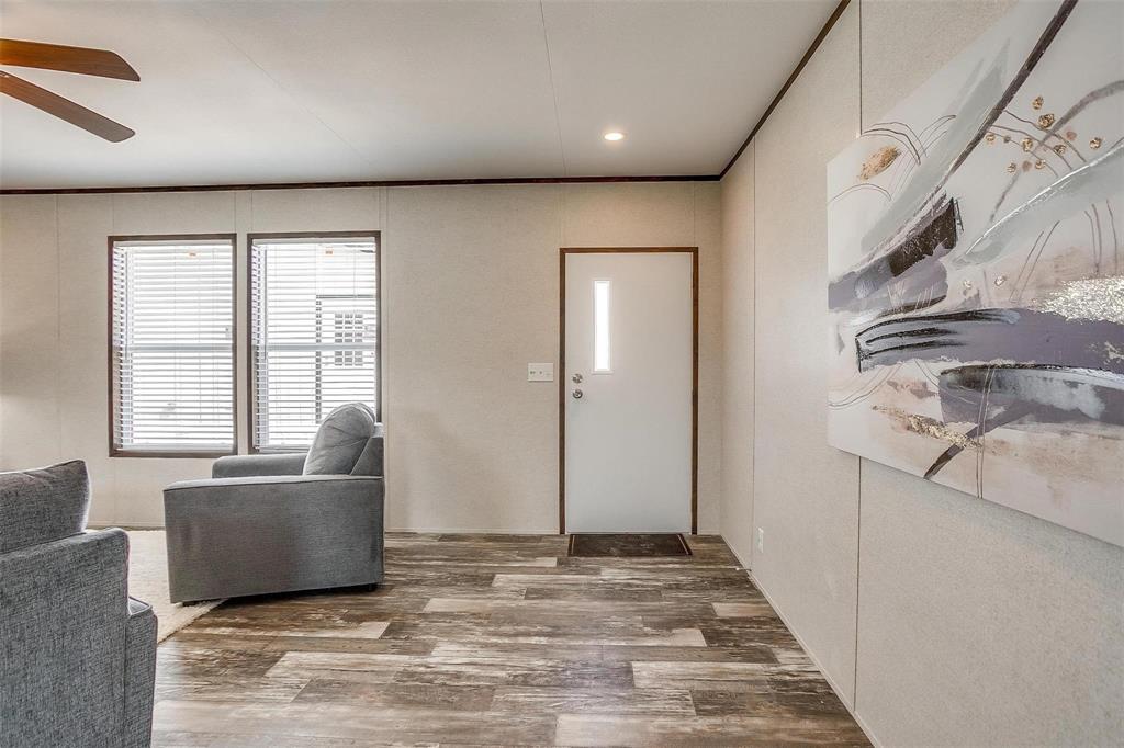 242 Huddleston Road Sunset, TX 76270 - Photo 5 of 18 a living room with furniture and large windows