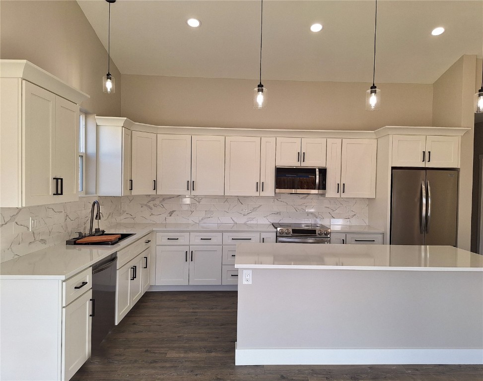 343 Lake View Road Hayden, CO 81639 - Photo 5 of 9 a large kitchen with stainless steel appliances kitchen island granite countertop a stove a sink and a refrigerator