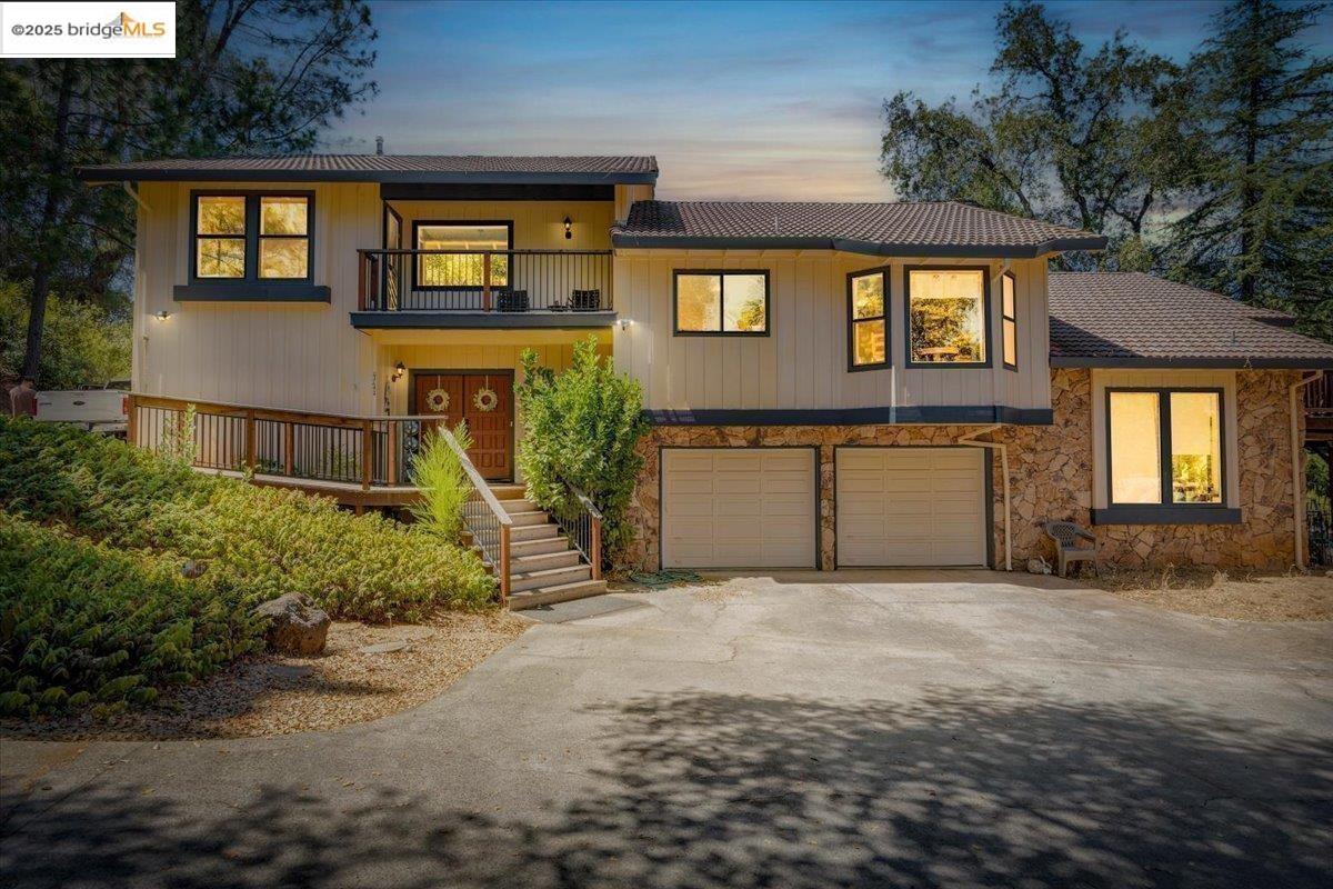 a front view of a house with garden