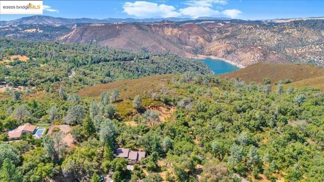 an aerial view of mountain with an outdoor space