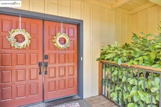 a view of a room with furniture and a window