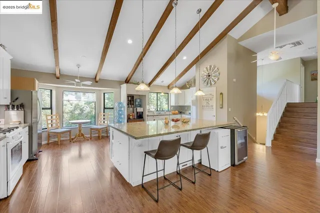 a bathroom with a shower and a sink a mirror