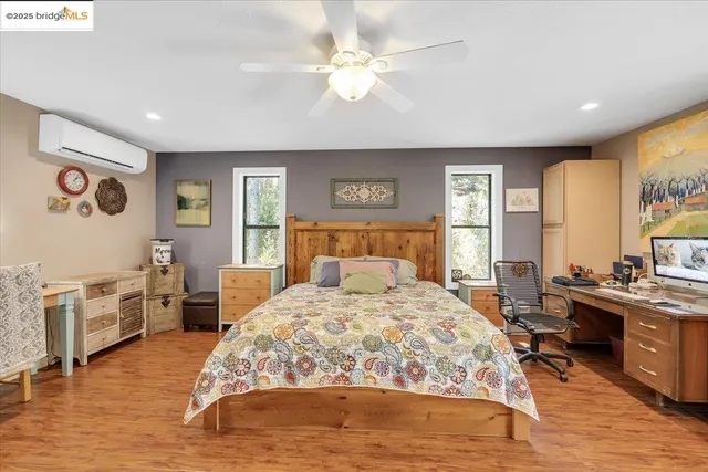 a view of a hallway with a livingroom and a bathroom with a sink
