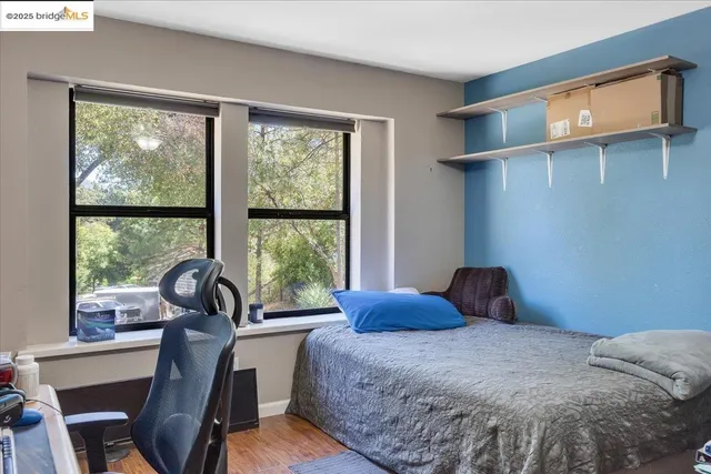 a bed room with furniture and a window