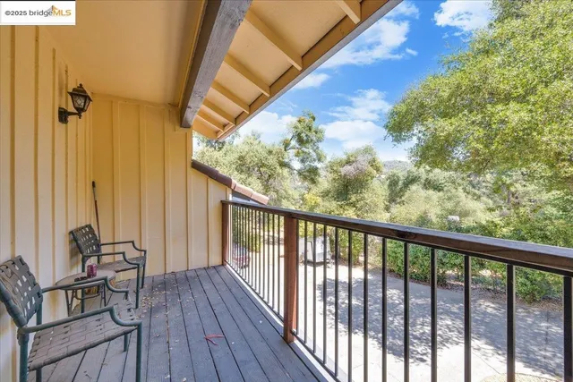 a view of a workspace with furniture and window