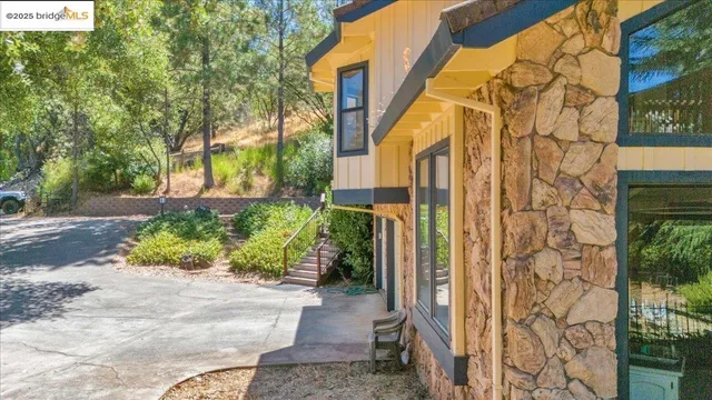 a view of a pathway along with brick walls