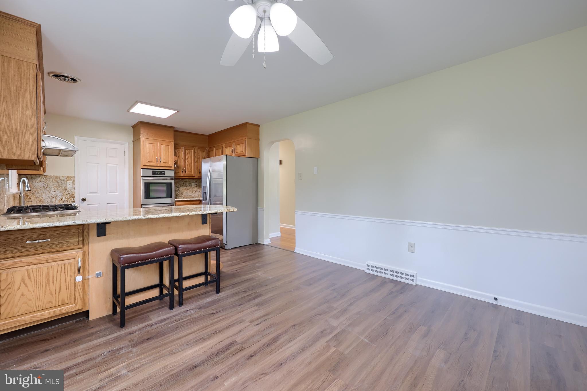 1046 Hunsicker Road Lancaster, PA 17601 - Photo 15 of 31 a open kitchen with cabinets wooden floor and stainless steel appliances