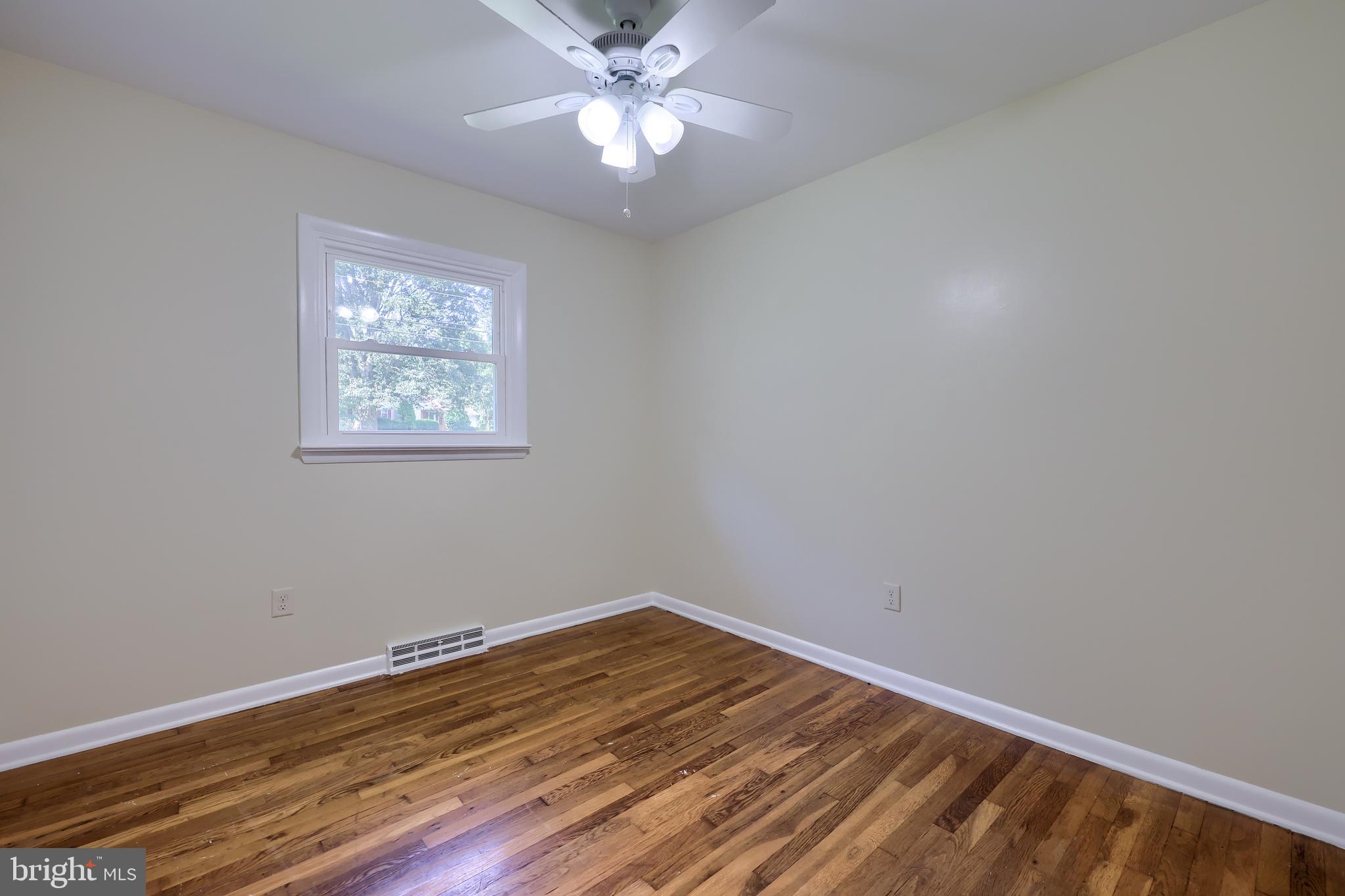1046 Hunsicker Road Lancaster, PA 17601 - Photo 16 of 31 a view of a room with wooden floor and a ceiling fan