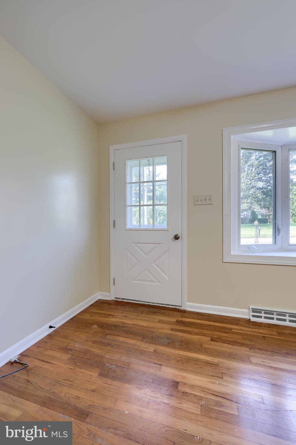 1046 Hunsicker Road Lancaster, PA 17601 - Photo 2 of 31 an empty room with wooden floor and windows