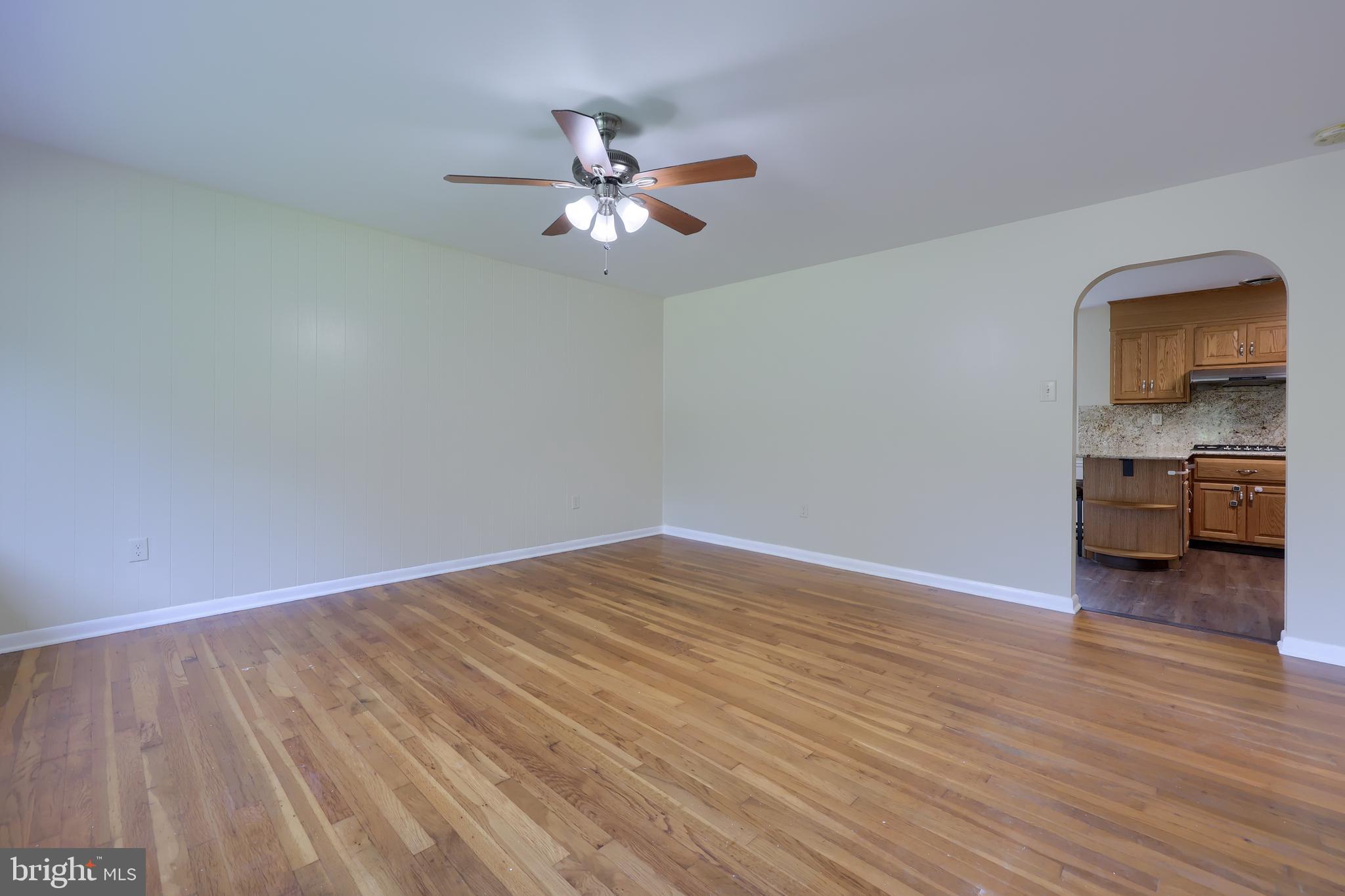 1046 Hunsicker Road Lancaster, PA 17601 - Photo 3 of 31 a view of empty room with wooden floor and fan