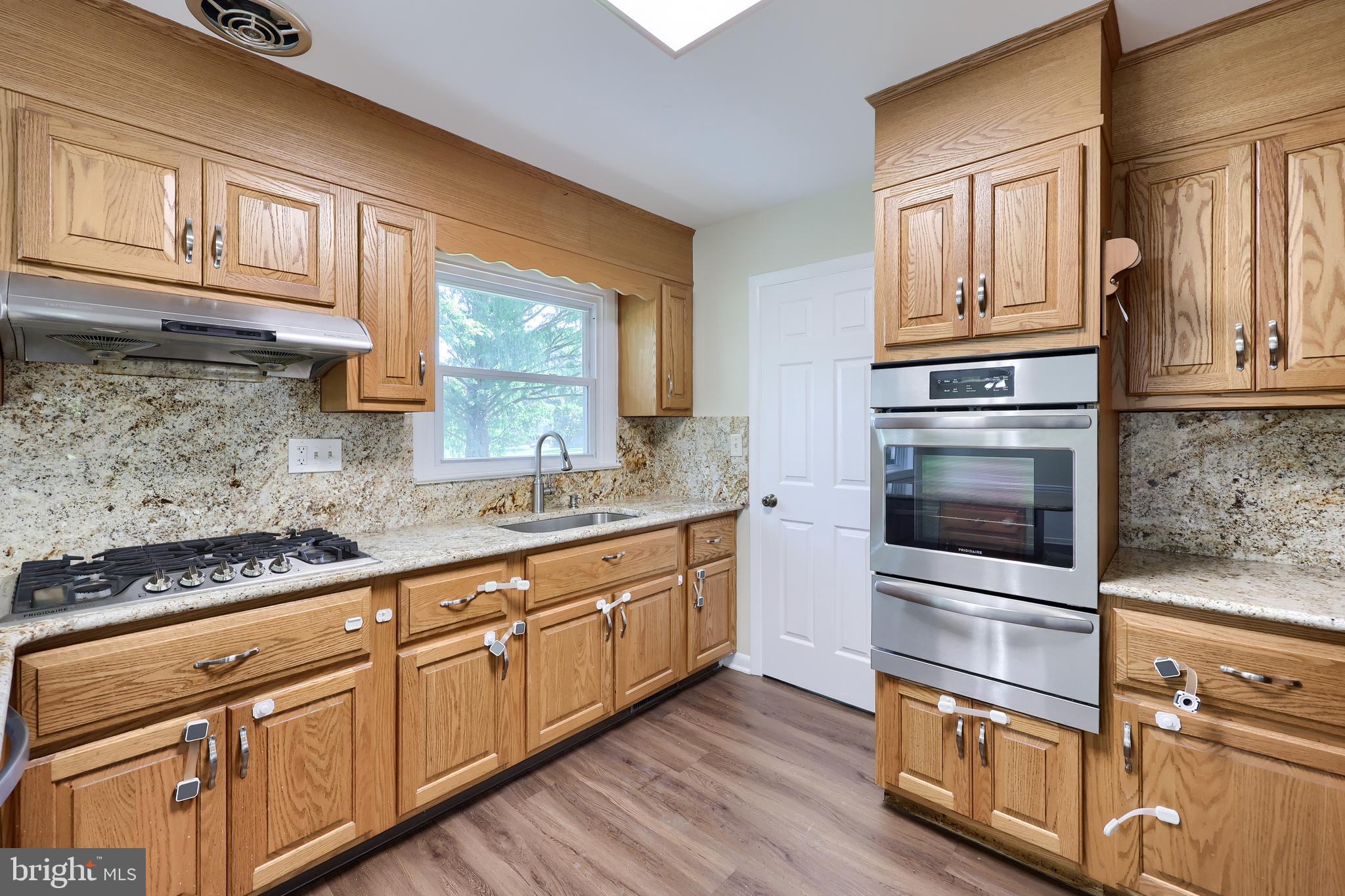 1046 Hunsicker Road Lancaster, PA 17601 - Photo 8 of 31 a kitchen with granite countertop stainless steel appliances and wooden cabinets