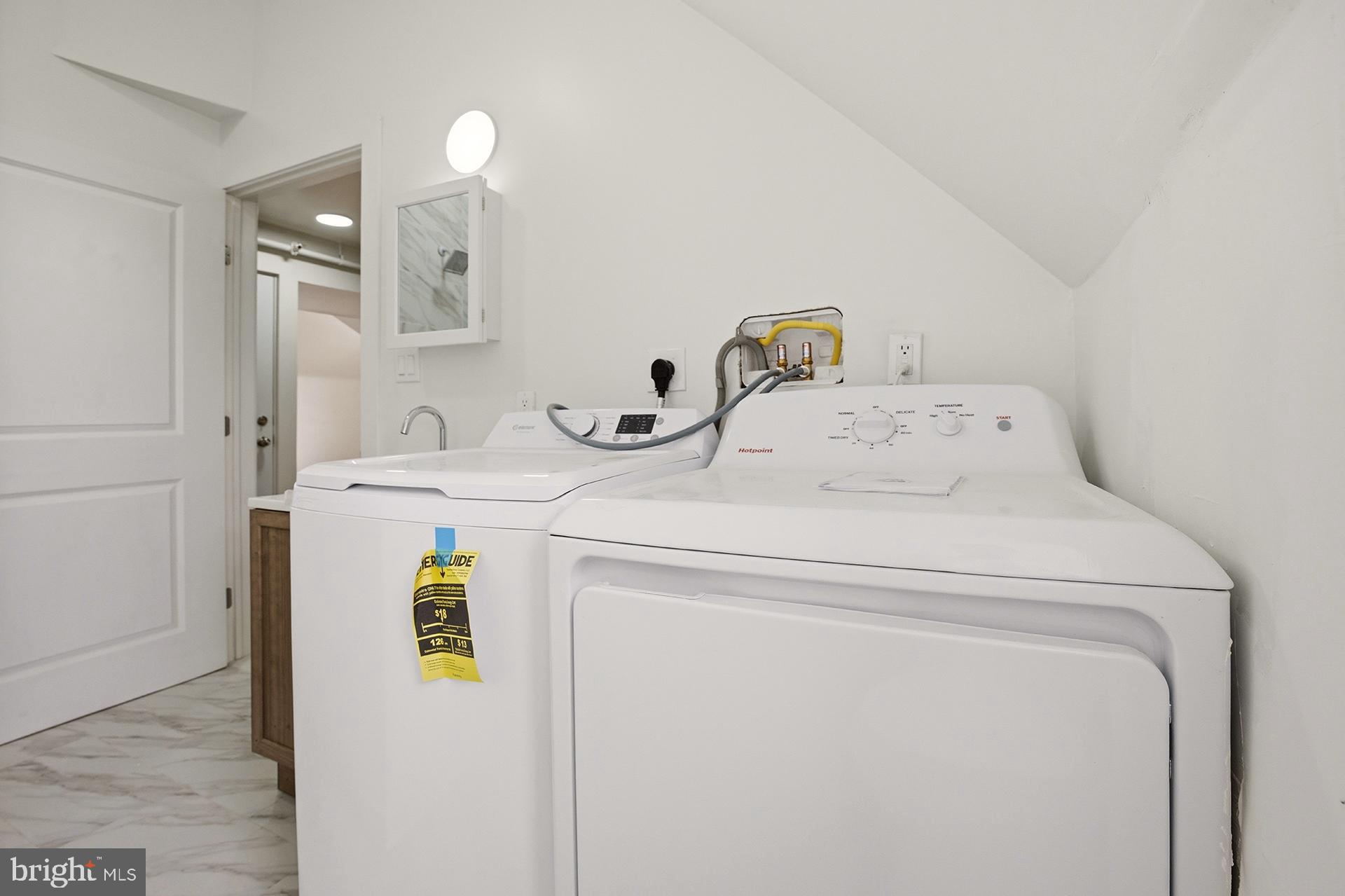 6012 Ridge Avenue, Unit 8 Philadelphia, PA 19128 - Photo 8 of 17 a utility room with dryer and washer