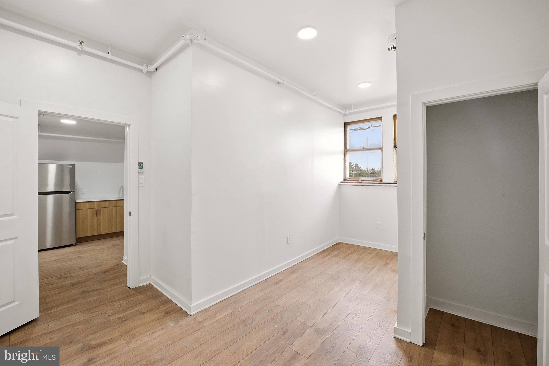 6012 Ridge Avenue, Unit 8 Philadelphia, PA 19128 - Photo 10 of 17 a view of hallway with wooden floor