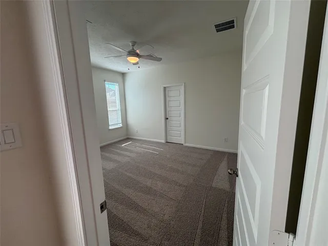 a view of a hallway with front door