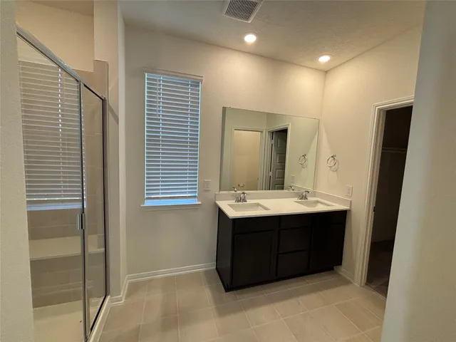 a bathroom with a sink and mirror