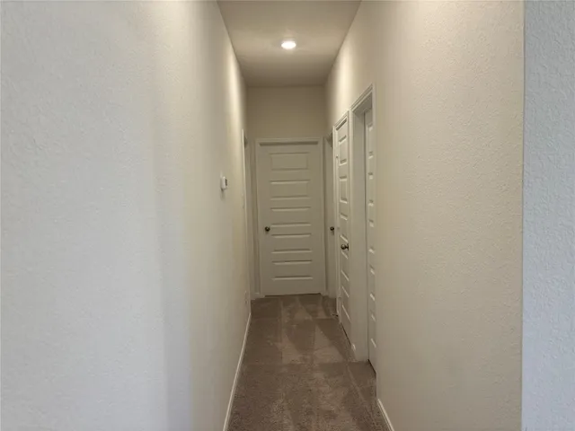 a view of hallway with closet