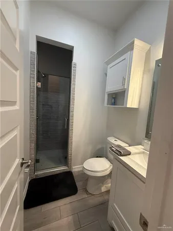 a bathroom with a sink a toilet a shower and a bathtub