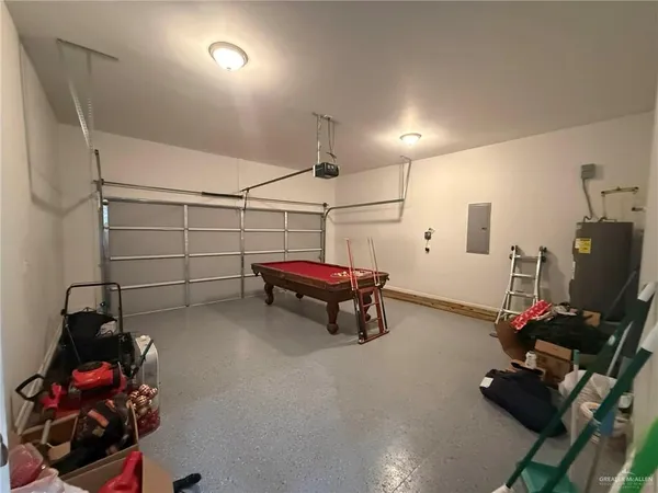a room with gym equipment and a flat screen tv