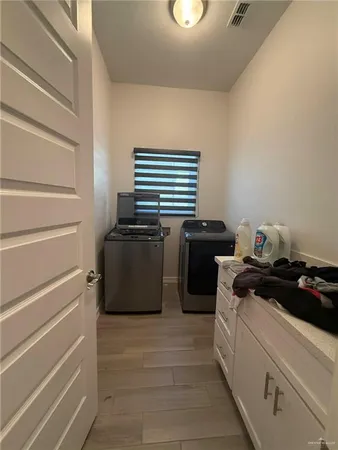 a kitchen with a stove and a refrigerator