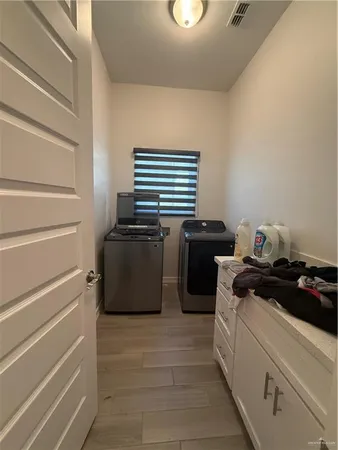 a kitchen with a stove and a refrigerator
