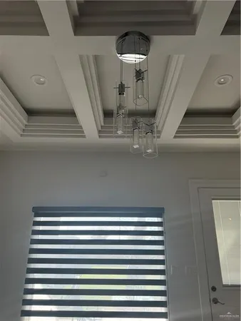 a view of a patio with table and chairs and potted plants