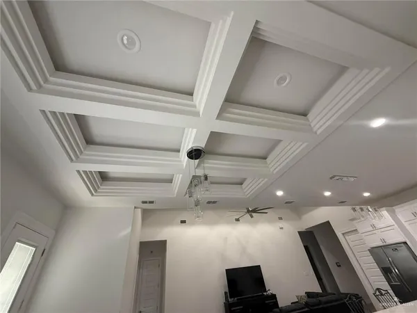 a view of a room with wooden floor