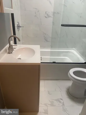 a bathroom with a sink and a bathtub