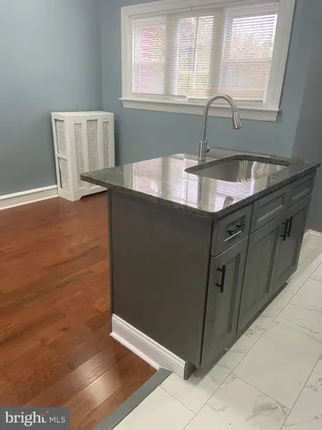 a kitchen with a sink and a window