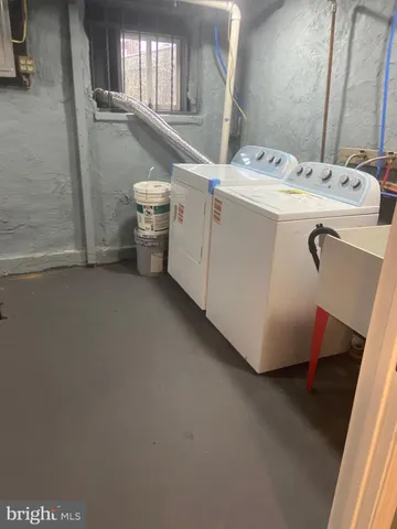 a room with a sink and mirror