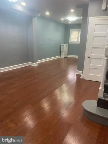 a view of a livingroom with wooden floor