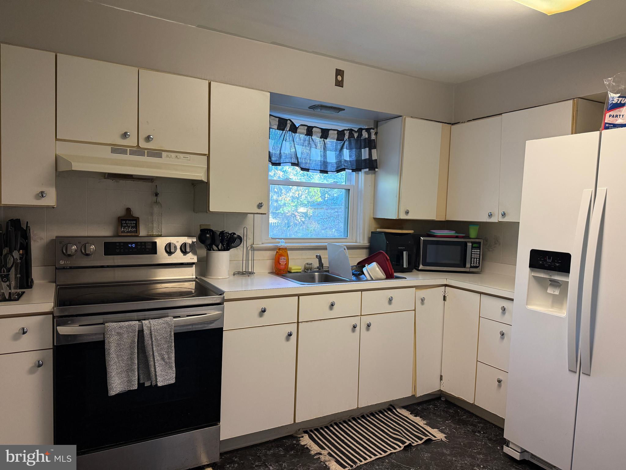 685 Colonial Avenue York, PA 17403 - Photo 12 of 45 a kitchen with white cabinets and white appliances