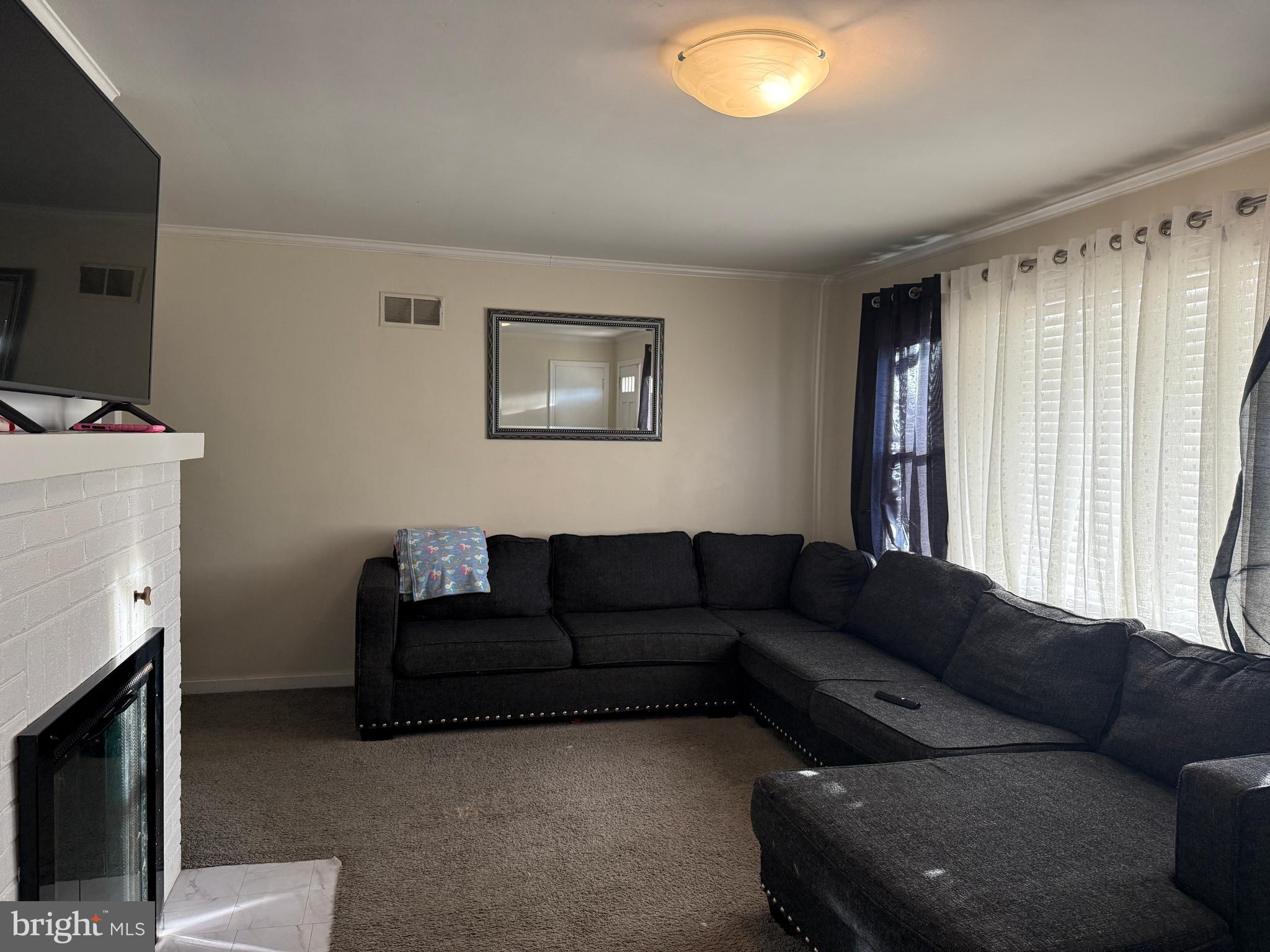 685 Colonial Avenue York, PA 17403 - Photo 4 of 45 a living room with furniture and a flat screen tv