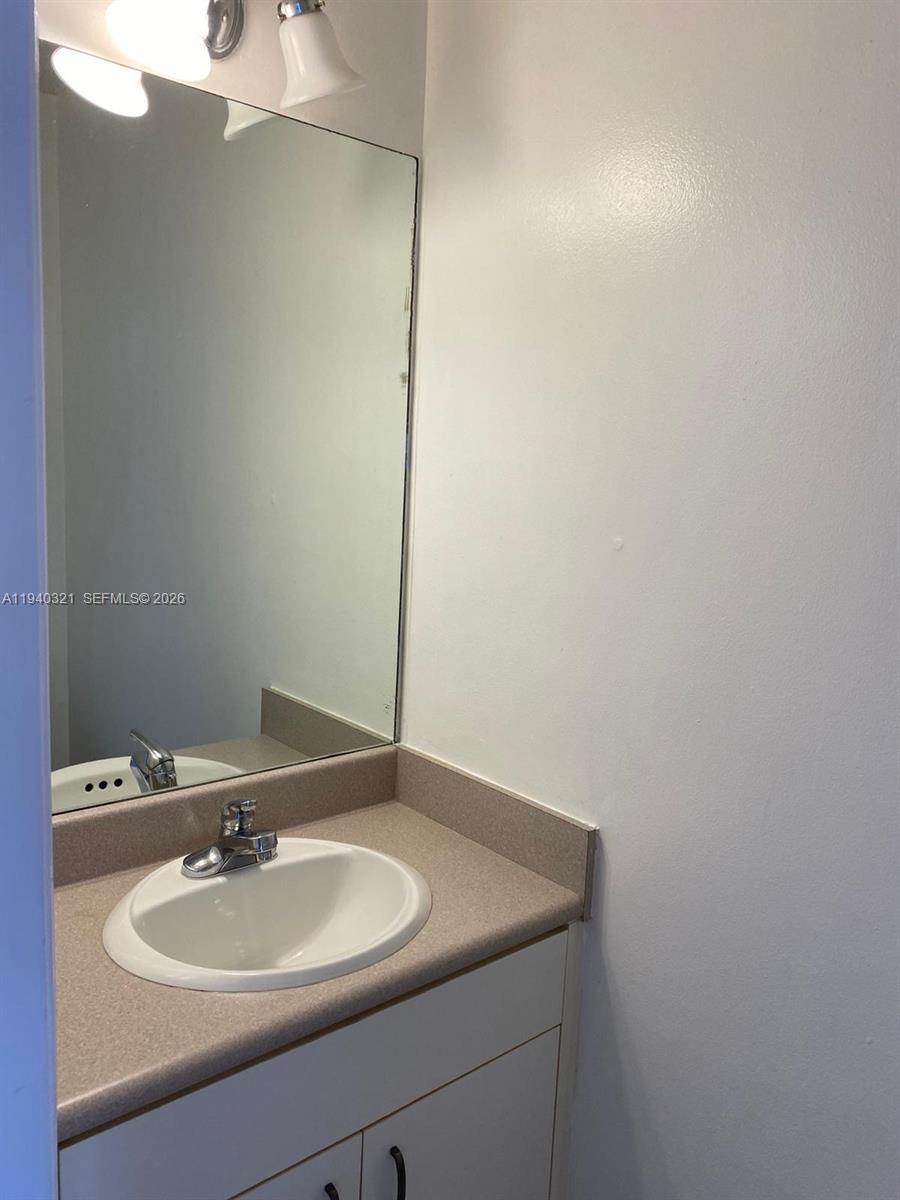 701 Brickell Key Boulevard, Unit LPH01 Miami, FL 33131 - Photo 12 of 15 a bathroom with a sink and a mirror