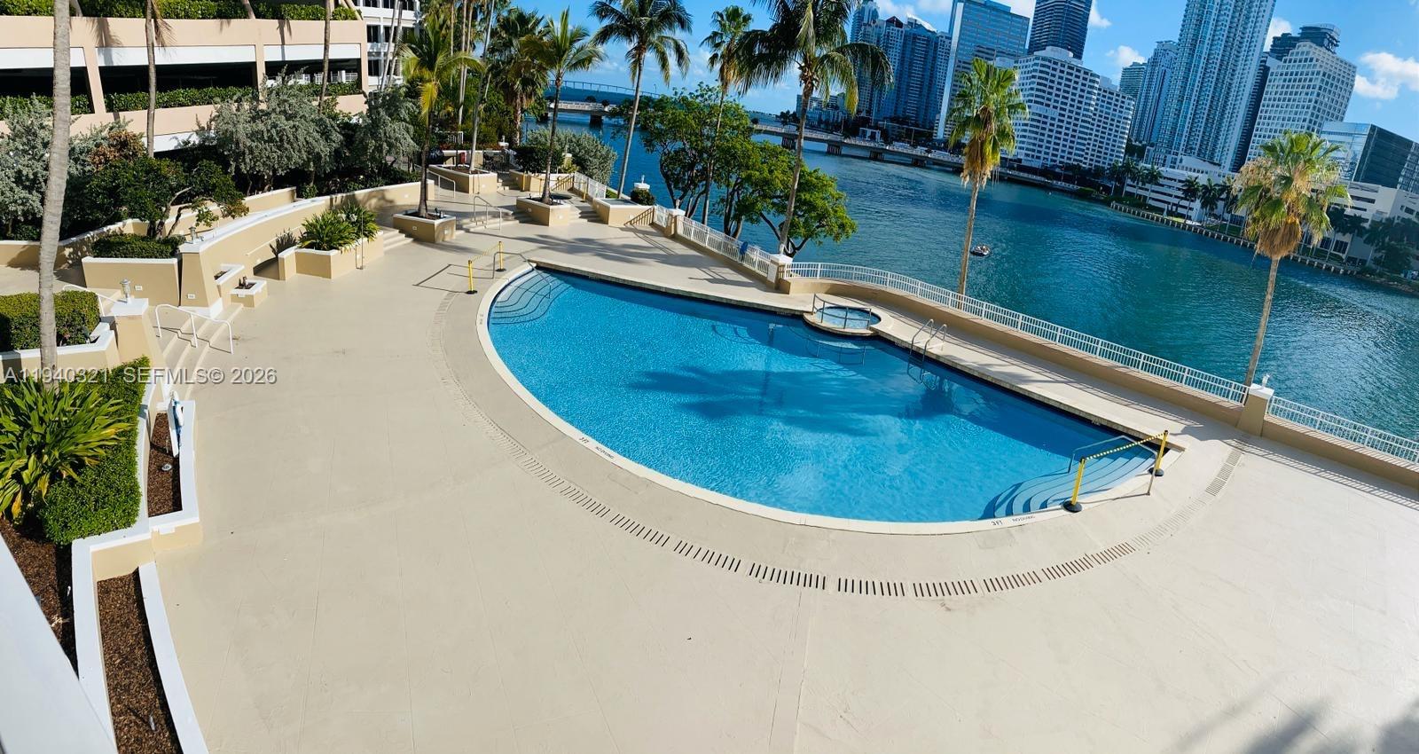 701 Brickell Key Boulevard, Unit LPH01 Miami, FL 33131 - Photo 15 of 15 a view of a swimming pool with a yard
