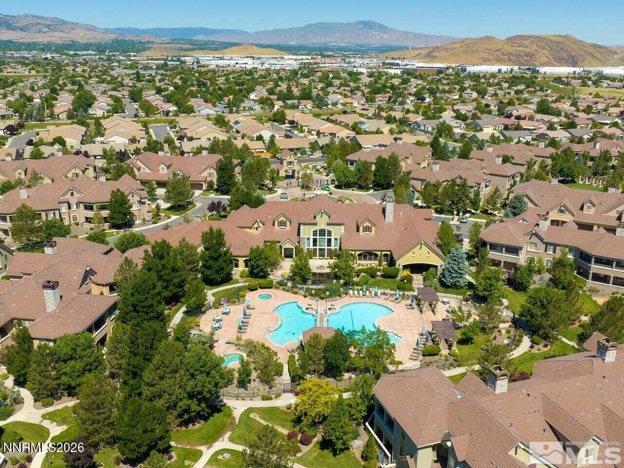 an aerial view of residential houses with outdoor space