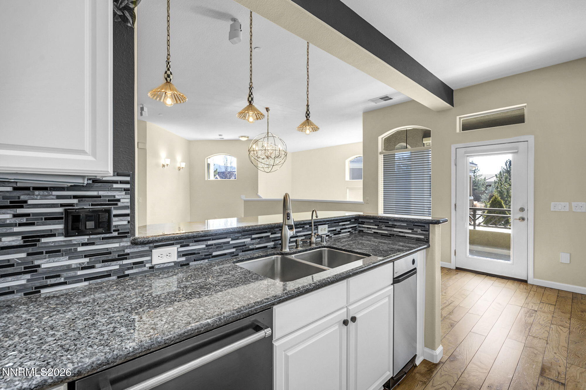 9900 Wilbur May Parkway, Unit 2504 Reno, NV 89521 - Photo 17 of 64 a kitchen with stainless steel appliances granite countertop a sink and a oven
