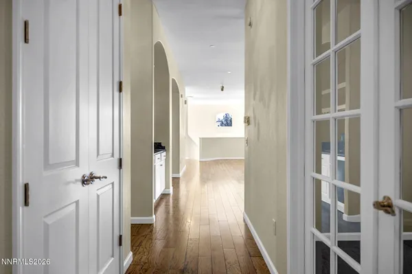 a view of an empty room with closet area
