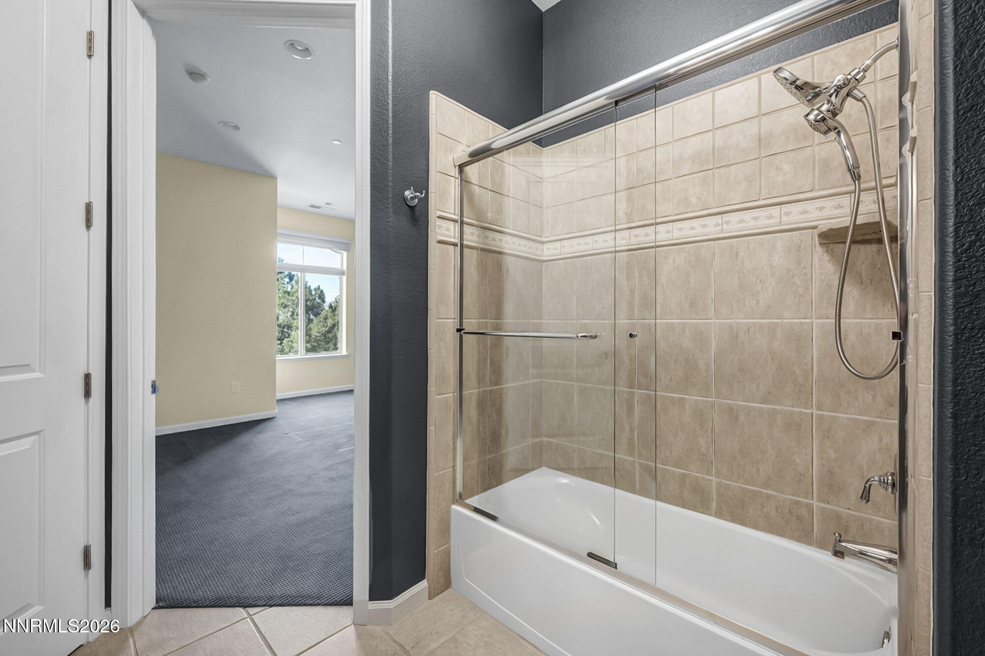 9900 Wilbur May Parkway, Unit 2504 Reno, NV 89521 - Photo 39 of 78 a bathroom with a bathtub and a shower