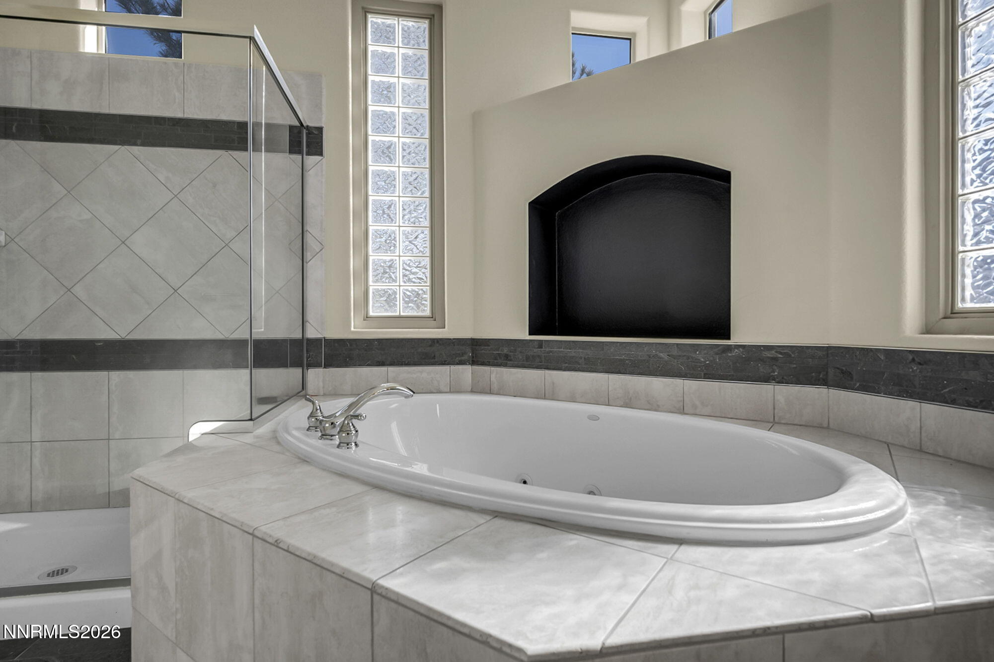 9900 Wilbur May Parkway, Unit 2504 Reno, NV 89521 - Photo 41 of 64 a bathroom with a sink and a bathtub