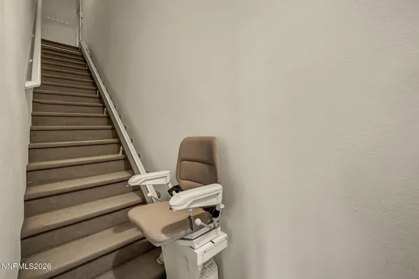 an aerial view of a house with a yard and lake view