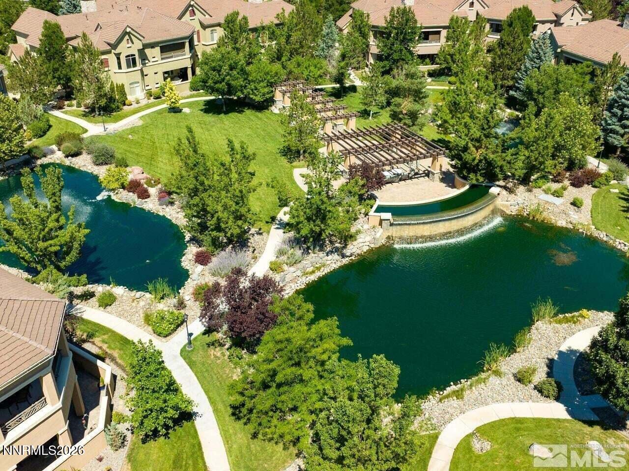 9900 Wilbur May Parkway, Unit 2504 Reno, NV 89521 - Photo 77 of 78 an aerial view of a house with a yard and lake view