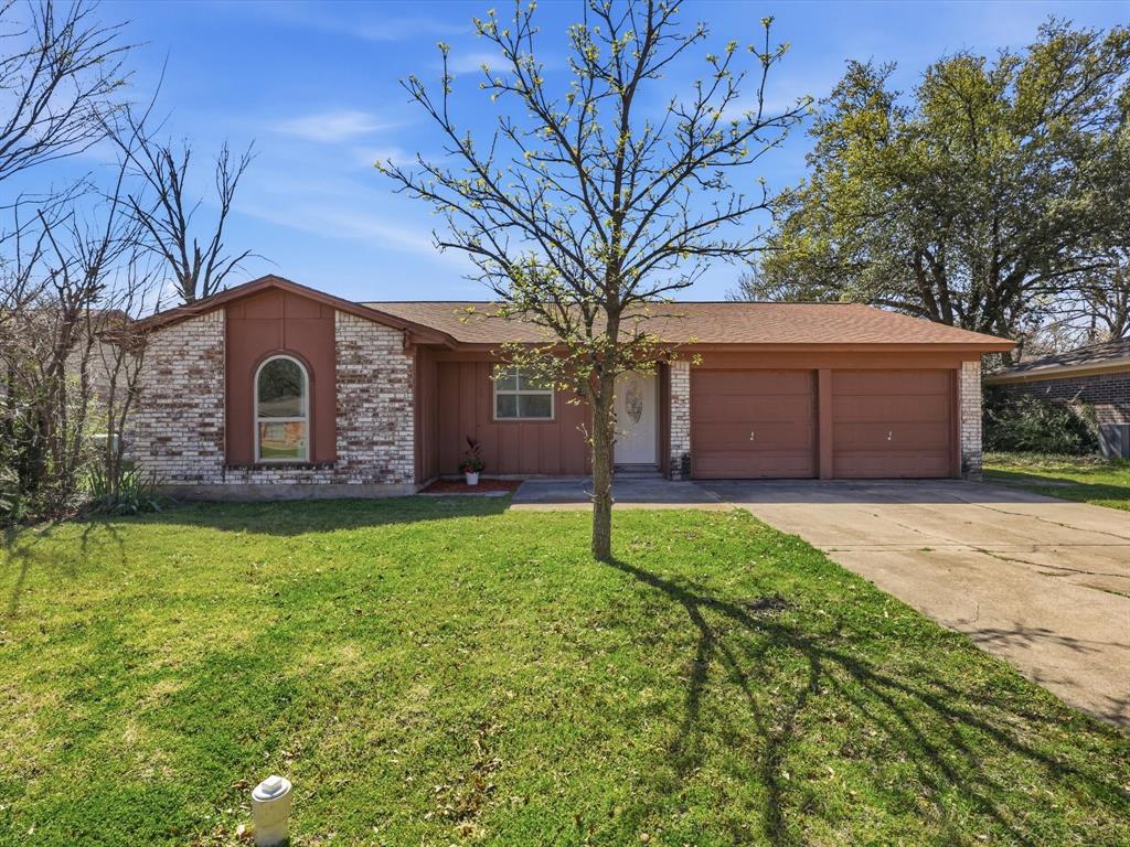 3228 Hummingbird Lane Denton, TX 76209 - Photo 1 of 27 a house view with a garden space