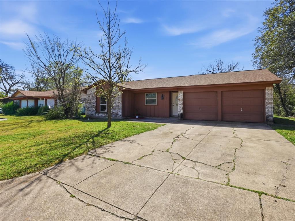 3228 Hummingbird Lane Denton, TX 76209 - Photo 2 of 27 a house view with a garden space