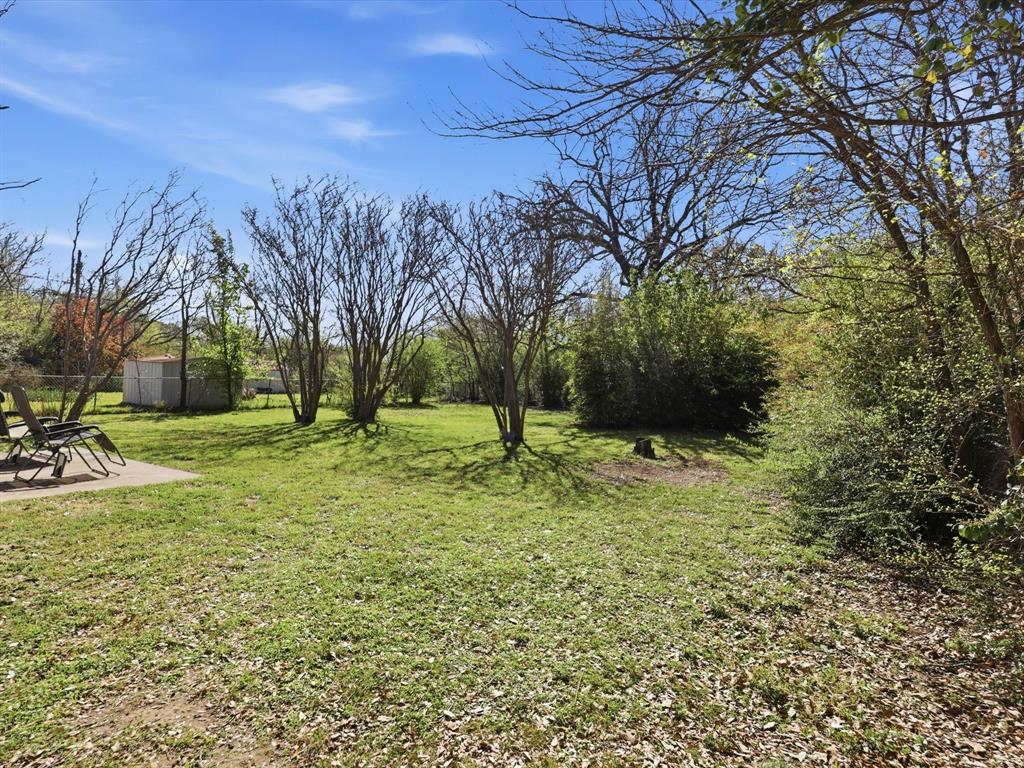 3228 Hummingbird Lane Denton, TX 76209 - Photo 23 of 27 a view of yard with tree