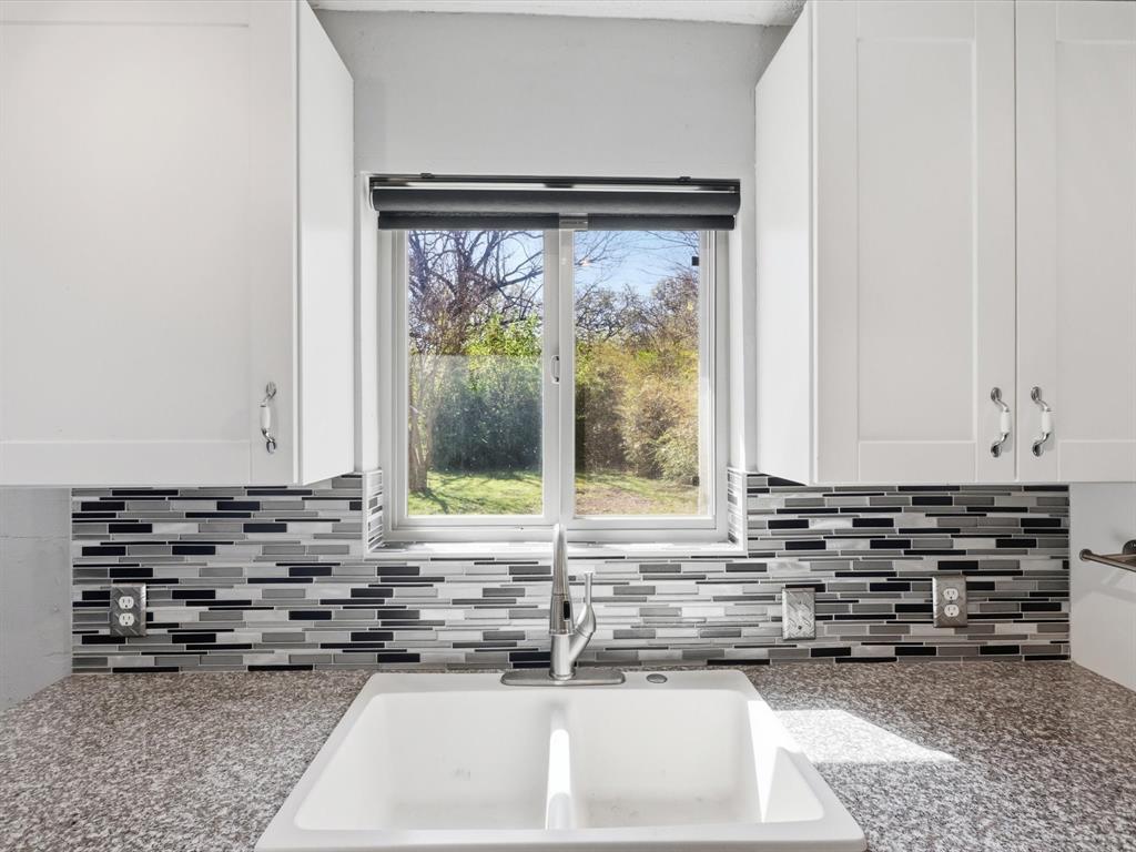 3228 Hummingbird Lane Denton, TX 76209 - Photo 8 of 27 a view of kitchen with sink window and cabinets