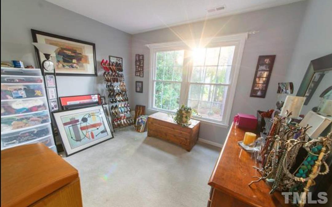 7613 Overland Trail Raleigh, NC 27615 - Photo 11 of 22 a living room with furniture and a flat screen tv